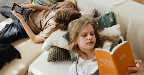 Siblings Lying on the Couch