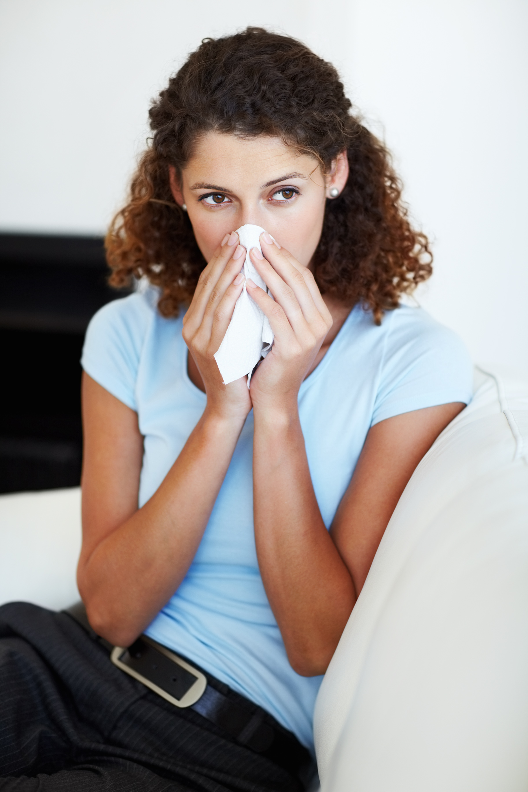 Women blowing nose