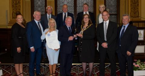 Image of The Lord Provost of Glasgow presenting the Queens Award to Cruden Staff, as part of the City Legacy Homes Consortium