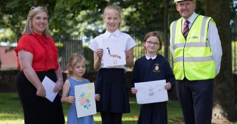 Cruden Homes’ sales and marketing director, Hazel Davies, competition runner-up, Ella, competition winner, Lotte, competition runner-up, Abigail and Cruden Homes’ contracts manager at the Meadowside development, Andy Brown, at the prize giving presentation held recently at Aberlady Primary School.