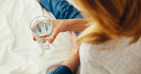 Women holding glass of water 